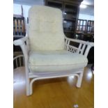 A WHITE PAINTED BAMBOO ARMCHAIR WITH BUTTON UPHOLSTERED BACK AND SEAT CUSHIONS