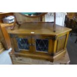 AN OAK CORNER TELEVISION STAND AND A DVD PLAYER (2)