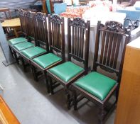 A SET OF SIX OAK HIGH BACK DINING CHAIRS, WITH CARVING TO THE TOP, WITH DROP-IN SEATS