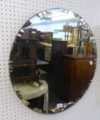 A VINTAGE CIRCULAR FRAMELESS WALL MIRROR, WITH FANCY BEVELLED EDGE, 23 1/2" DIAMETER (60cm)