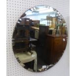 A VINTAGE CIRCULAR FRAMELESS WALL MIRROR, WITH FANCY BEVELLED EDGE, 23 1/2" DIAMETER (60cm)