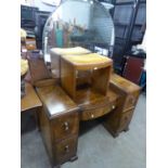 A WALNUTWOOD KNEE-HOLE DRESSING TABLE, WITH LARGE CIRCULAR MIRROR, DRESSING STOOL AND A CHEST OF