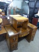 A WALNUTWOOD KNEE-HOLE DRESSING TABLE, WITH LARGE CIRCULAR MIRROR, DRESSING STOOL AND A CHEST OF