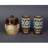 PAIR OF DOULTON LAMBETH SLATER’S PATENT MOULDED POTTERY VASES, each of footed, cylindrical form,