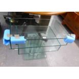 A MODERN THREE TIER REVOLVING TELEVISION STAND FROM ARIGHI BIANCHI, WITH PLATE GLASS SHELVES AND A