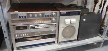 THREE OLD TYPEWRITERS IN CASES AND AN AMSTRAD STEREO SYSTEM WITH SPEAKERS