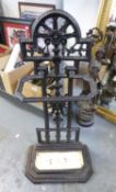 BLACK PAINTED CAST IRON STICK OR UMBRELLA STAND, WITH PIERCED BACK CAST WITH A SUNBURST AND CREAM