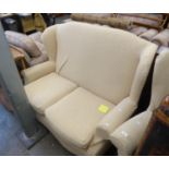 A WINGED LOUNGE SUITE OF THREE PIECES, VIZ A TWO SEATER SETTEE AND A PAIR OF WINGED LOUNGE CHAIRS,