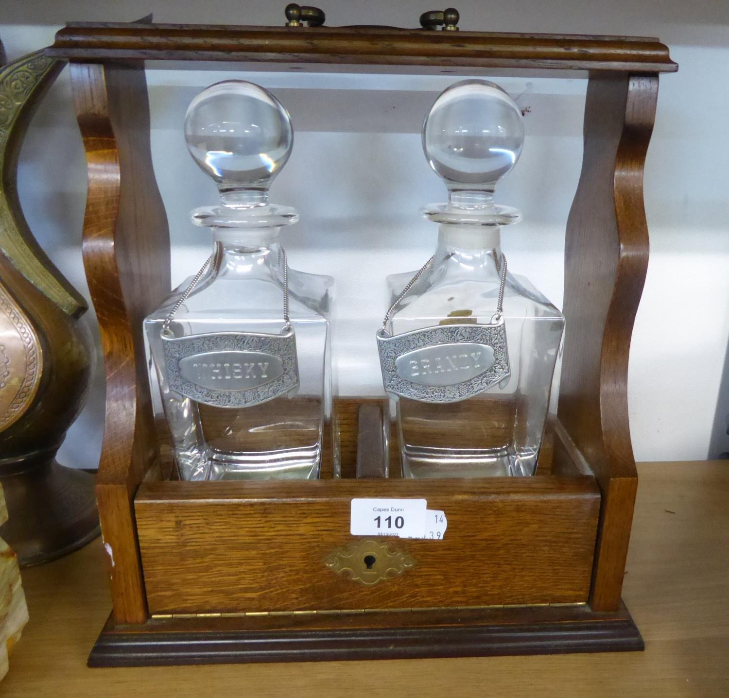 AN OAK TWO DIVISION TANTALUS FRAME WITH TWO ITALIAN ‘RCR PRIMAVERA’ PLAIN GLASS SPIRIT DECANTERS