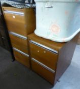 A POLISHED WOOD THREE DRAWER FILING CABINET AND A TWO DRAWER FILING CABINET