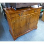 GEORGIAN STYLE YEW-WOOD SIDE CABINET, WITH TWO COCKBEADED SHORT FRIEZE DRAWERS OVER TWO DOORS, ON