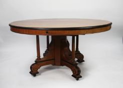 VICTORIAN AESTHETIC MOVEMENT FIGURED WALNUT AND PARCEL EBONISED WIND-OUT EXTENDING DINING TABLE, the
