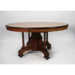 VICTORIAN AESTHETIC MOVEMENT FIGURED WALNUT AND PARCEL EBONISED WIND-OUT EXTENDING DINING TABLE, the