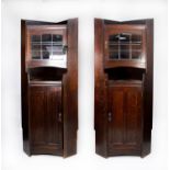 LIBERTY, LONDON, PAIR OF DARK OAK FLOOR STANDING CORNER CABINETS, each with shelf top above a nine