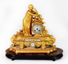 MID TO LATE 19TH CENTURY FRENCH GILT MANTEL CLOCK, with sectional Sevres style Roman numeral dial