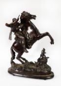 IN THE STYLE OF FREDERIC REMINGTON, BRONZED SPELTER FIGURE OF A COWBOY ON A REARING HORSE, rifle