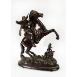 IN THE STYLE OF FREDERIC REMINGTON, BRONZED SPELTER FIGURE OF A COWBOY ON A REARING HORSE, rifle