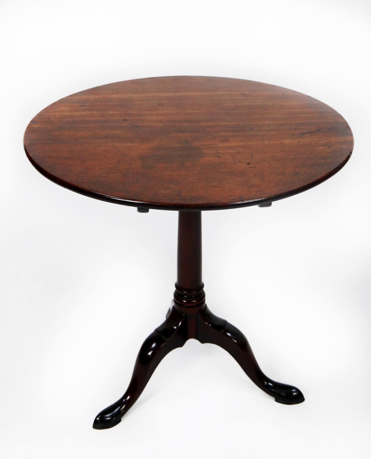 GEORGIAN MAHOGANY TILT TOP OCCASIONAL TABLE, the circular top set above a gun barrel turned