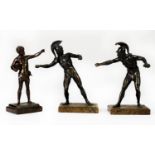 EARLY 20th CENTURY DARK PATINATED BRONZE CLASSICAL FIGURE OF A BOY standing releasing a bird from