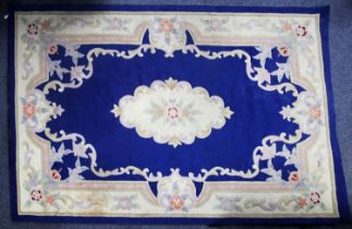 CHINESE ACRYLIC CARPET OF AUBUSSON DESIGN with white and floral centre and border, plain royal