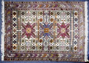 EASTERN SMALL CARPET OF KUBA, CAUCASIAN DESIGN, with large triple star pattern medallions on a white