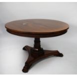 EARLY NINETEENTH CENTURY CARVED ROSEWOOD TILT TOP DINING TABLE, the circular top with gadrooned edge