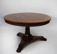 EARLY NINETEENTH CENTURY CARVED ROSEWOOD TILT TOP DINING TABLE, the circular top with gadrooned edge