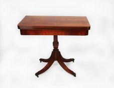 MODERN REPRODUCTION REGENCY STYLE FIGURED MAHOGANY PEDESTAL CARD TABLE, the flame cut, rounded