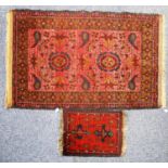 SHIRAZ PERSIAN RUG with two large floral medallions on a pink field, the principal border wine red