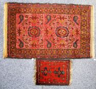 SHIRAZ PERSIAN RUG with two large floral medallions on a pink field, the principal border wine red