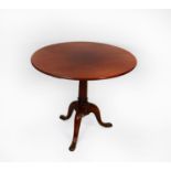 ANTIQUE MAHOGANY TRIPOD BREAKFAST TABLE, the circular tilt top raised on a gun barrel column and