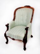 VICTORIAN CARVED ROSEWOOD EASY ARMCHAIR, the moulded show wood frame with floral cresting to the