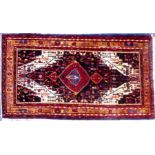 PERSIAN HAMADAN CARPET with large concentric diamond shaped crimson on midnight blue on a white