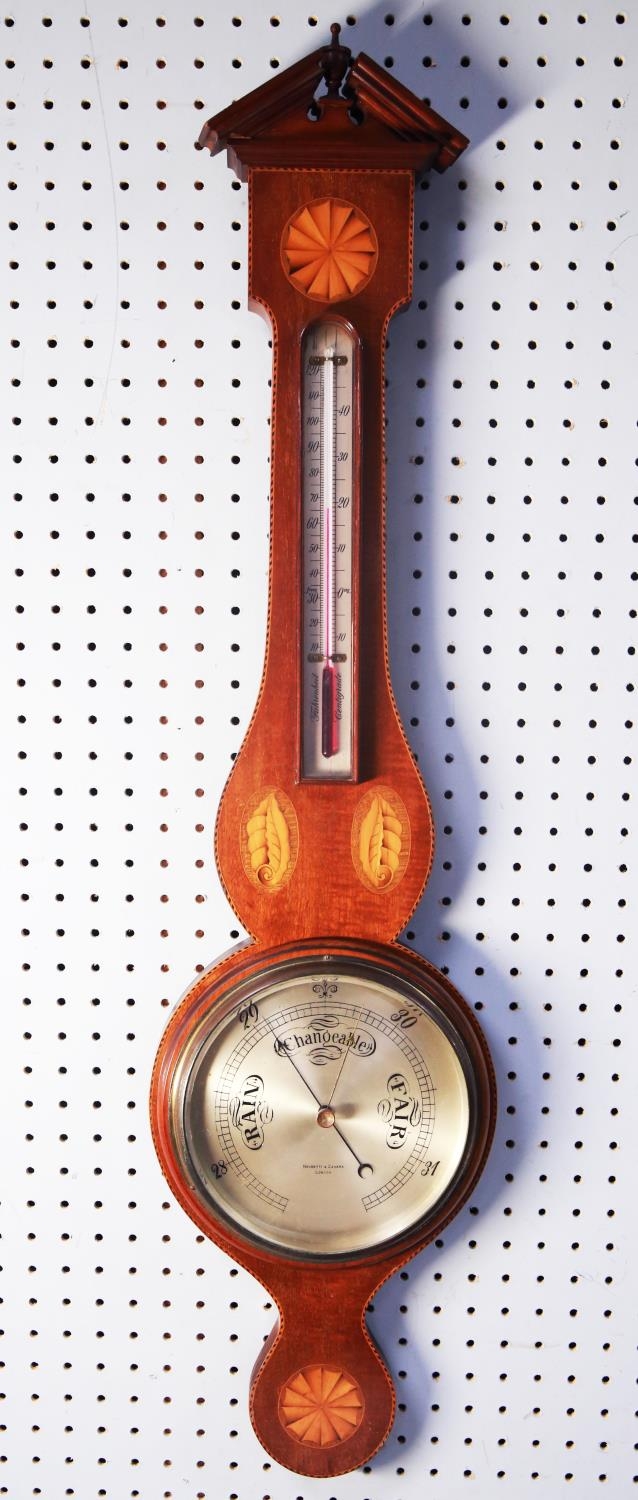 NEGRETTI AND ZAMBRA INLAID MAHOGANY ANEROID BAROMETER, the 8” silvered dial set beneath an alcohol