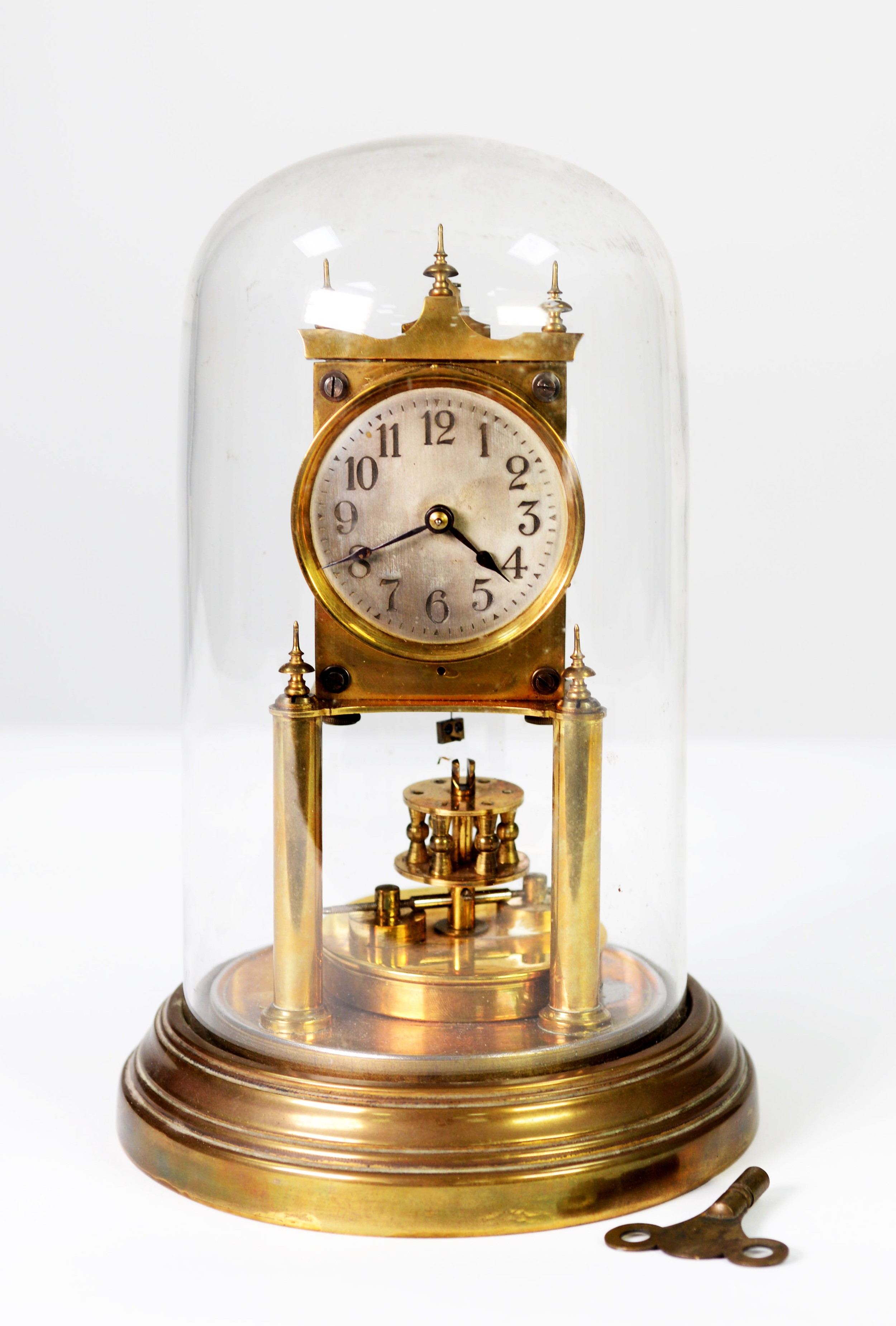 19TH CENTURY GUSTAV BECKER BRASS ANNIVERSARY CLOCK, with silvered arabic numeral dial, presented