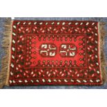 SMALL AFGHAN RUG, crimson with white detail, 1ft 10in x 1ft 3in ((60 x 40cm) and 4 OTHER SMALL RUGS,