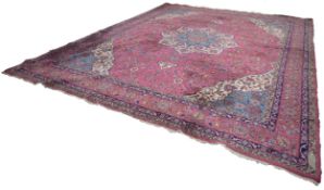 SEMI-ANTIQUE KERMANSHAH LARGE PERSIAN CARPET with pale blue and ivory petal shaped centre