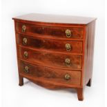 REGENCY FIGURED, LINE INLAID AND CROSSBANDED MAHOGANY BOW FRONTED CHEST OF DRAWERS, the flame cut