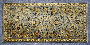 GERMAN ALL-WOOL CARPET, labelled Kashan pattern, with an all-over design of birds and wild animals