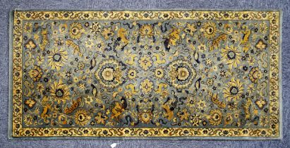 GERMAN ALL-WOOL CARPET, labelled Kashan pattern, with an all-over design of birds and wild animals