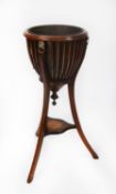 EDWARD VII MAHOGANY BASKET PLANTER WITH COPPER LINER, lion mask roundels, and beadwork festoons, all