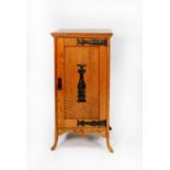 EARLY TWENTIETH CENTURY ARTS AND CRAFTS LIGHT OAK BEDSIDE CABINET, the moulded oblong top above a
