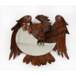 BLACK FOREST STYLE CARVED FRUITWOOD CRESCENT MIRROR, the bas relief carved spread-eagle clasping the