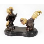 20th CENTURY BRONZED METAL FIGURES OF TWO FIGHTING COCKS, with gilt painted detail mounted on a