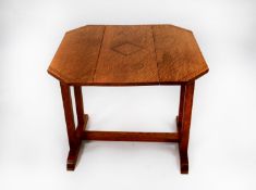 TWO EARLY TWENTIETH CENTURY LIGHT OAK OCCASIONAL TABLES, one with drop leaves and swivel top, the