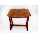 TWO EARLY TWENTIETH CENTURY LIGHT OAK OCCASIONAL TABLES, one with drop leaves and swivel top, the