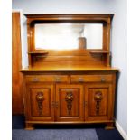 EARLY TWENTIETH CENTURY ARTS AND CRAFTS LIGHT OAK MIRROR BACK SIDEBOARD, the canopied back with