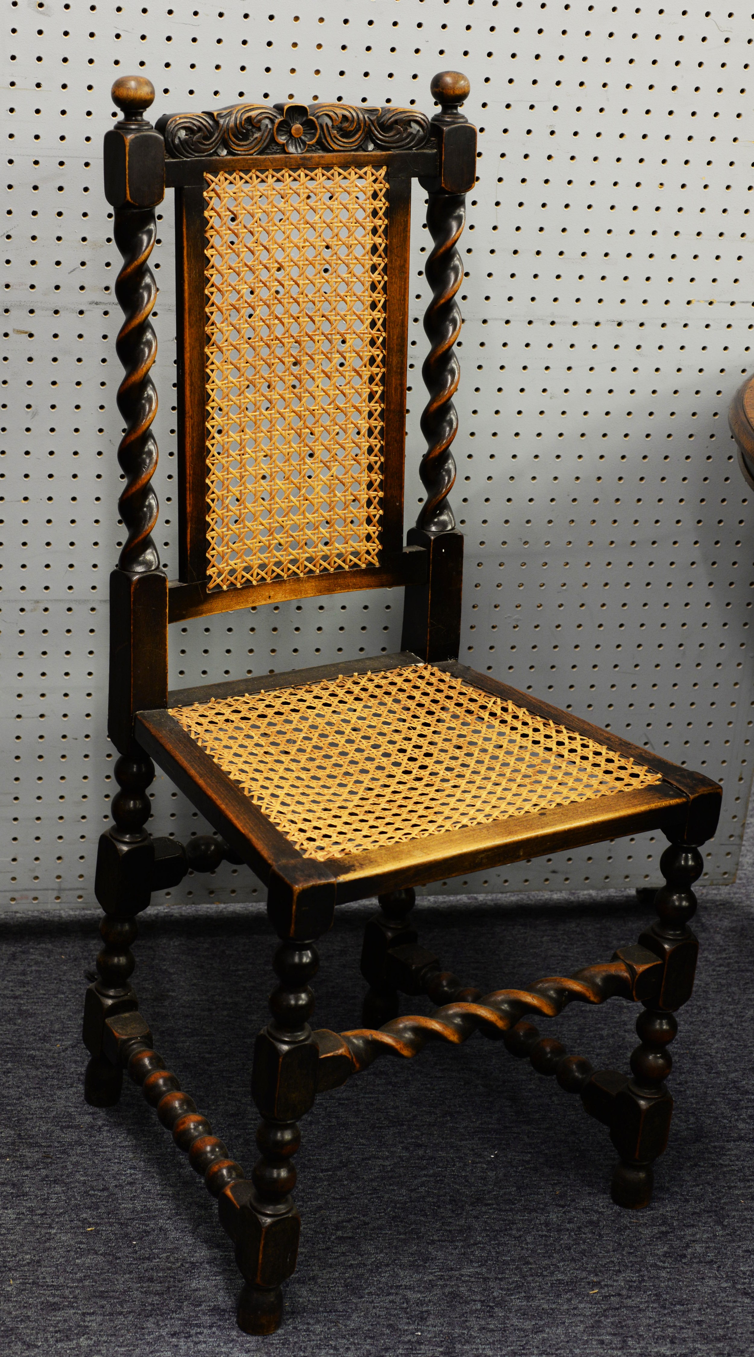 SET OF SIX CAROLEAN STYLE CARVED DARK OAK STAINED FRUITWOOD SINGLE DINING CHAIRS WITH CANED SEATS