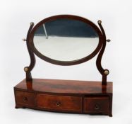 EARLY NINETEENTH CENTURY LINE INLAID AND FIGURED MAHOGANY TOILET MIRROR, the oval plate in a