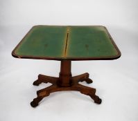 LATE VICTORIAN FIGURED MAHOGANY PEDESTAL CARD TABLE, the flame cut swivel top enclosing a green